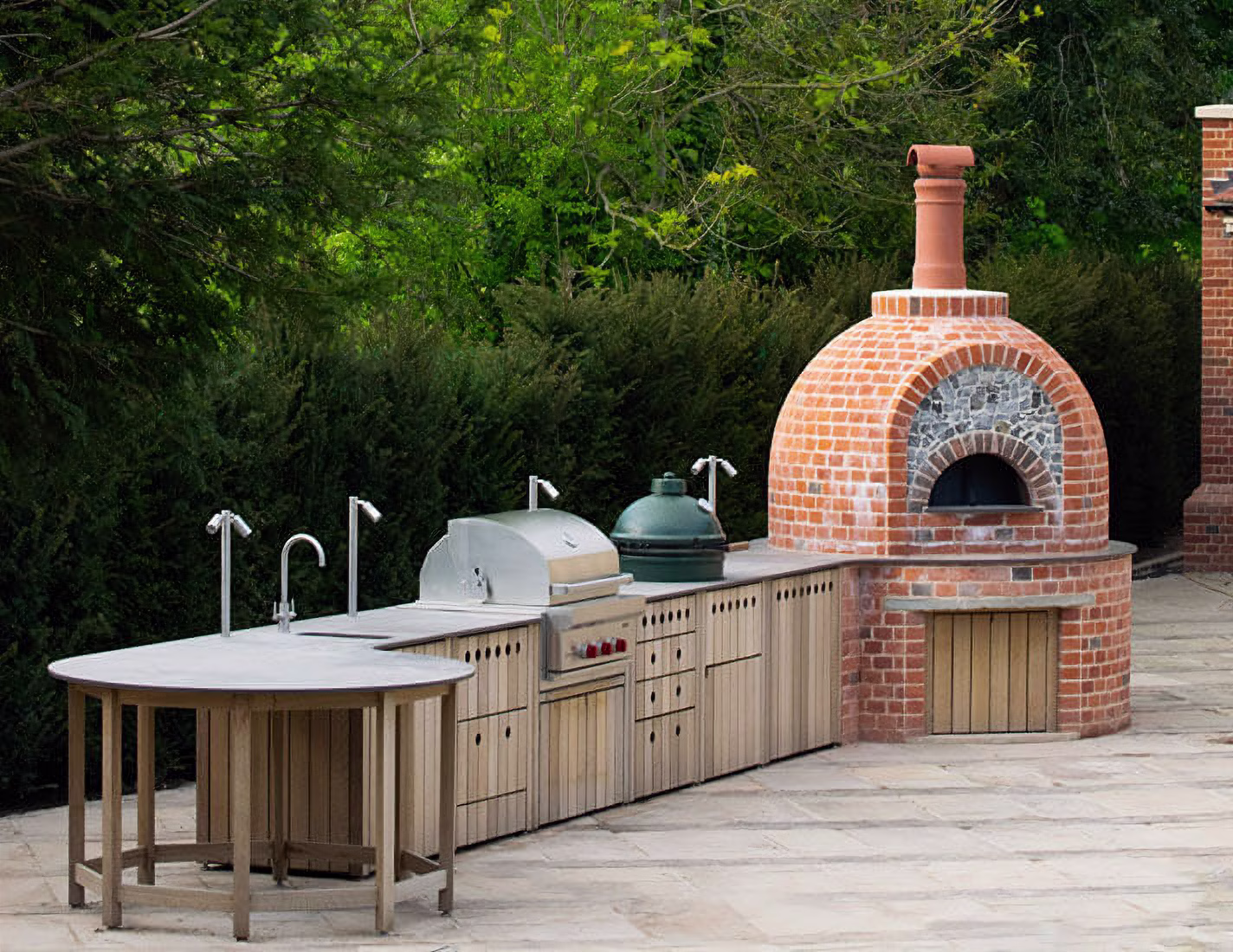 A £100,000+ custom outdoor kitchen made of brick and oak